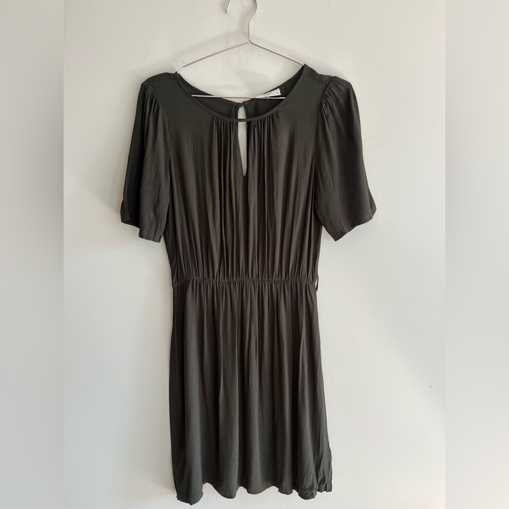 Dark Green dress with a keyhole detail at the neckline with shirred shoulder